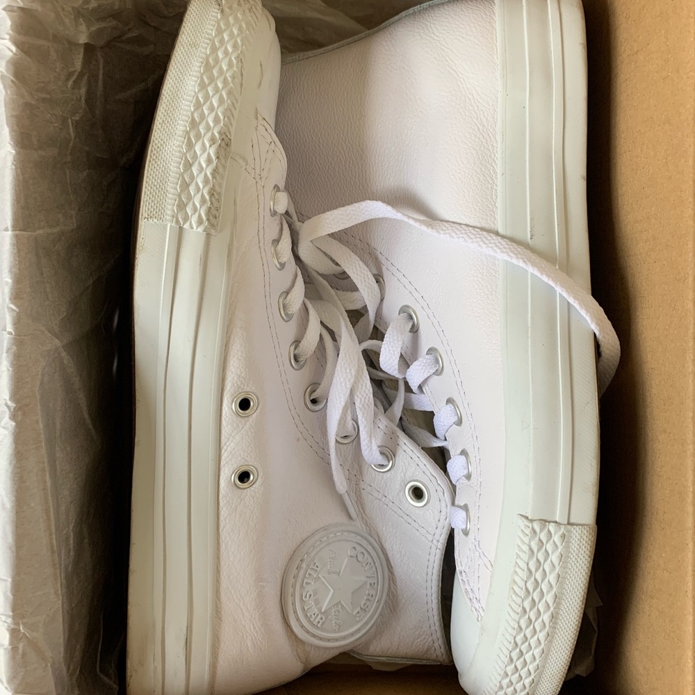 Size 9 women’s, 7 men’s Converse unisex white leather high tops